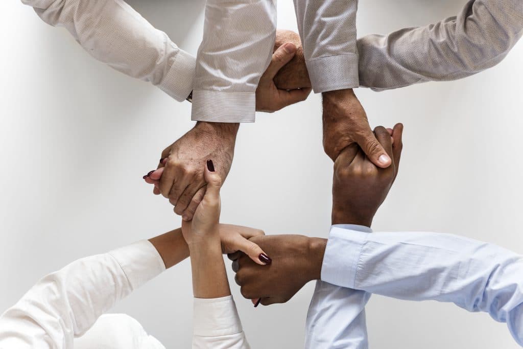 Hands joined together in teamwork